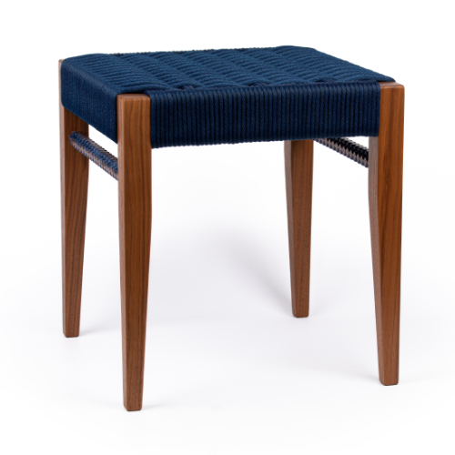 An upholstered stool with wooden legs.