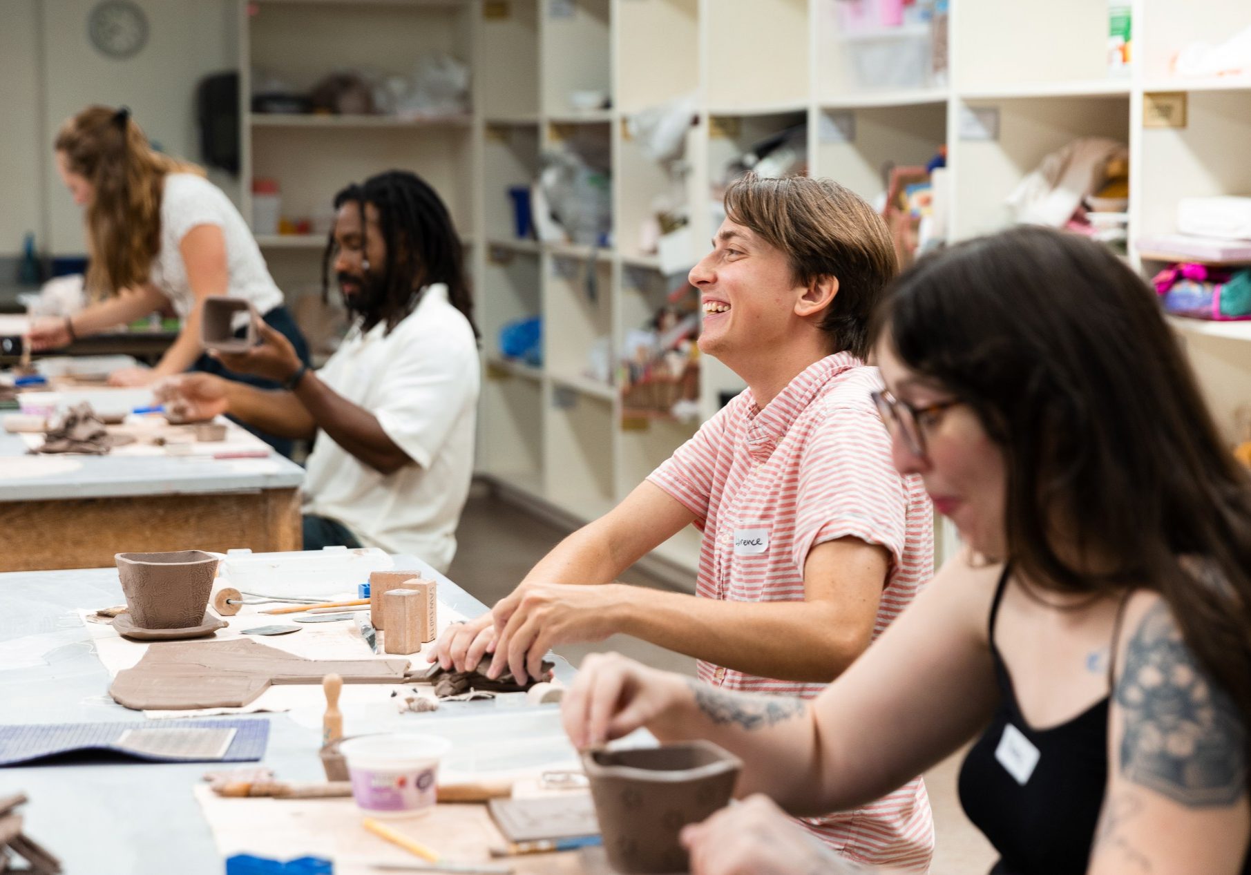 People participating in a ceramics workshop.