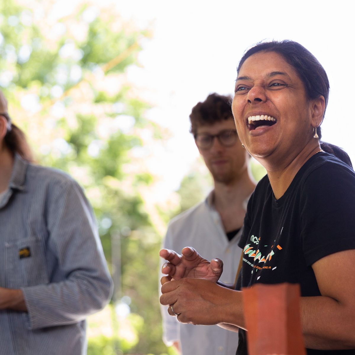 Woman laughing during a ceramics class.