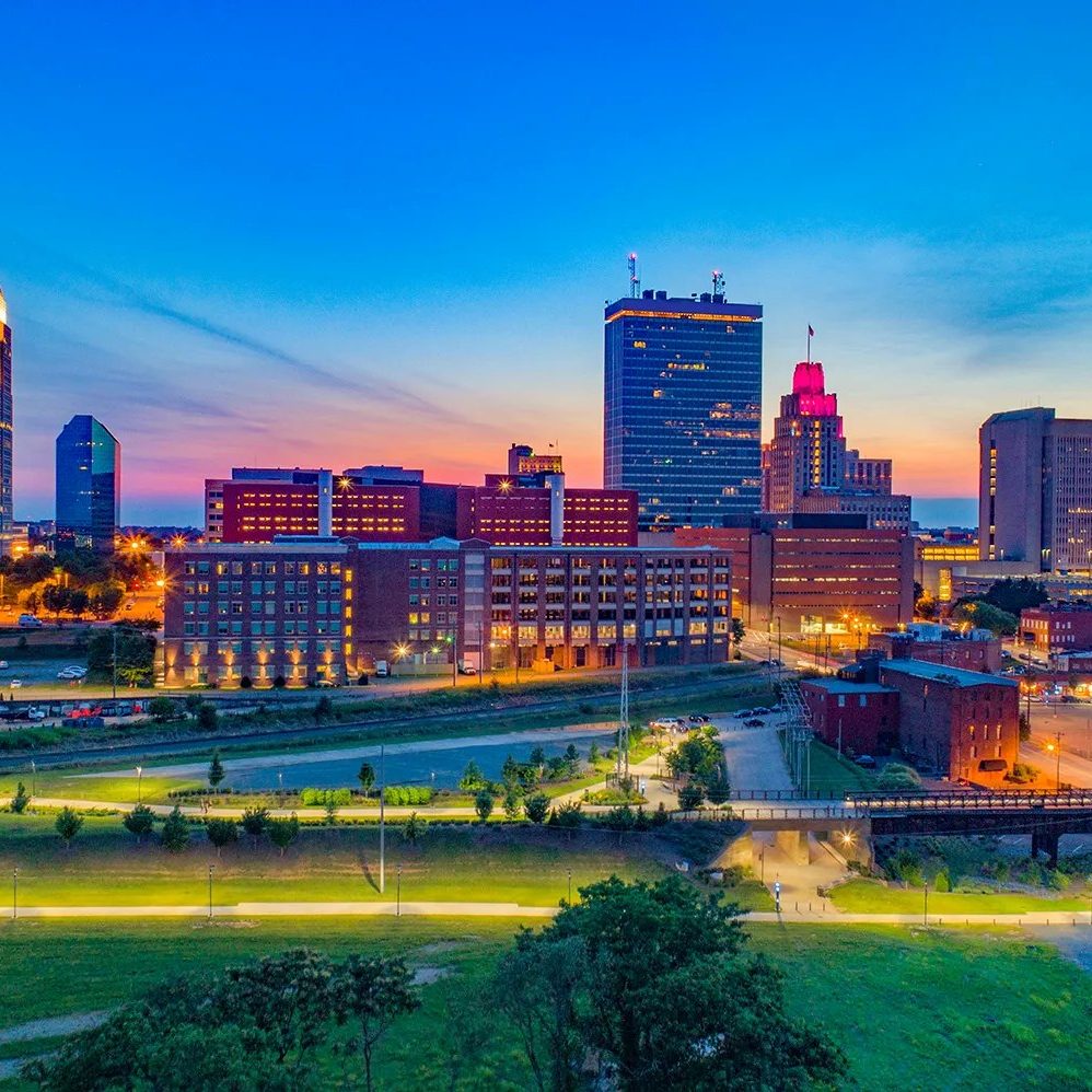 Panoromic view of the Winston-Salem city skyline at dusk.